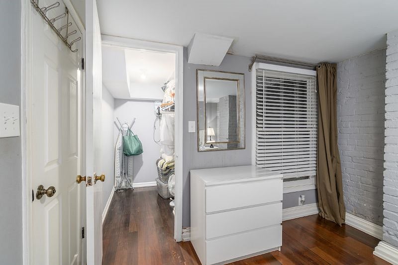 first bedroom with walk in closet