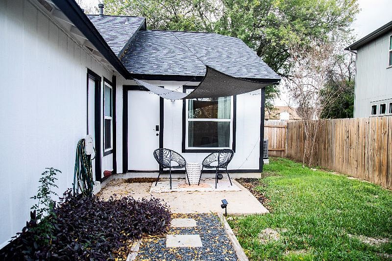 Cozy patio set up with sunshade.
Fully fenced backyard for pets.
Yard is maintained with regular mowing.