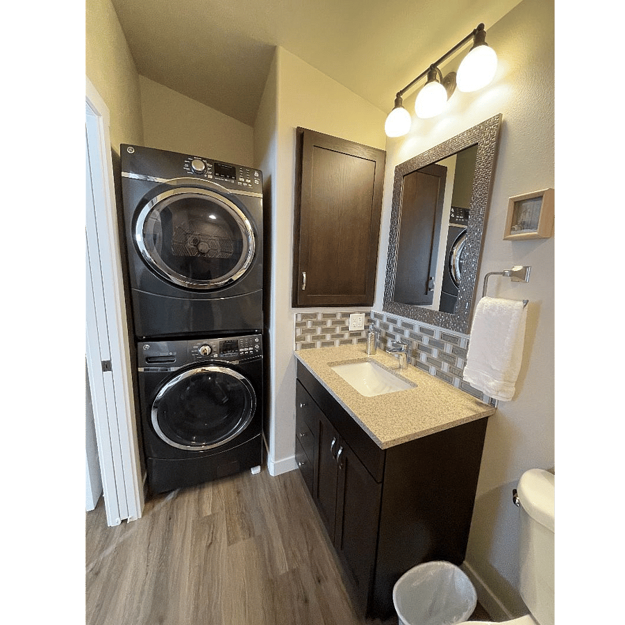 Full size washer and dryer included. Medicine cabinet pulls out for additional storage of laundry supplies and towels.