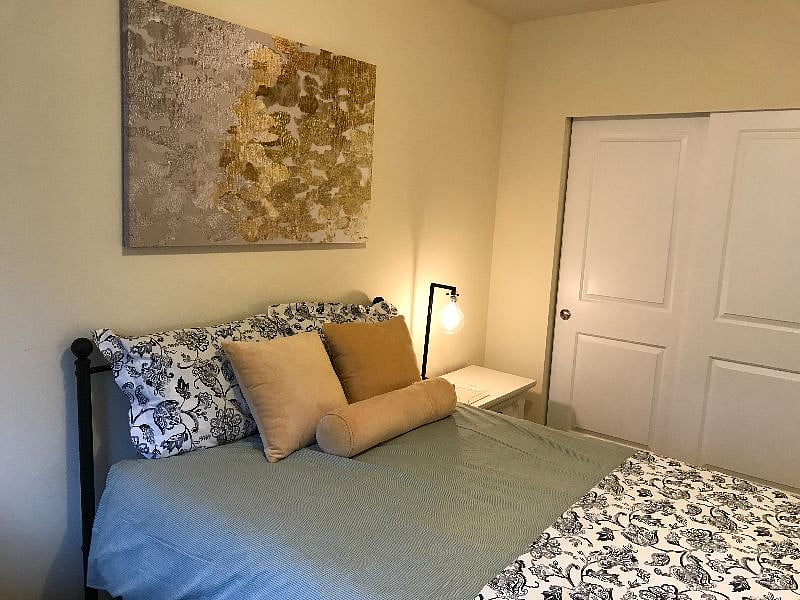 Full-sized bed with new mattress.