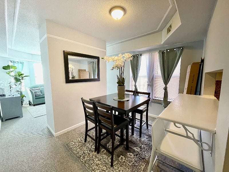 Separate dining room with eat-in bar area