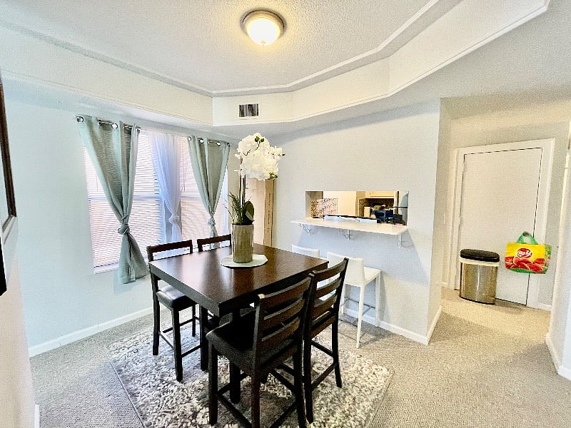 Separate dining room with eat-in bar area