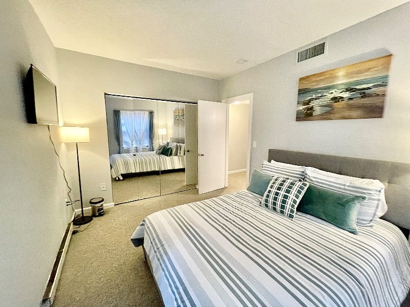 Master bedroom with large closet, private balcony