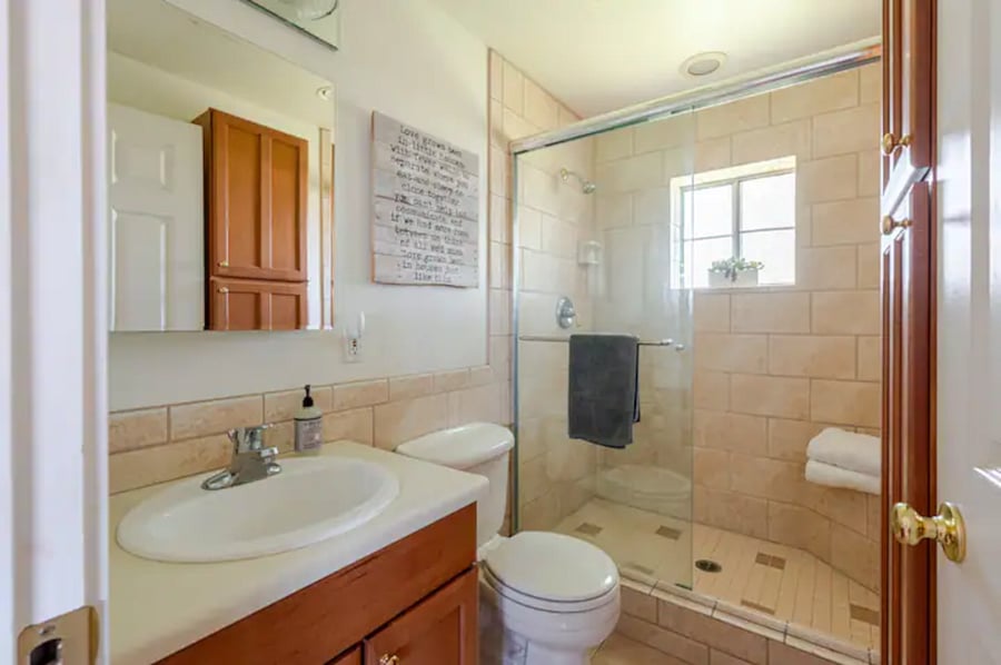 The bathroom gets great natural light and the tile shower large and clean.