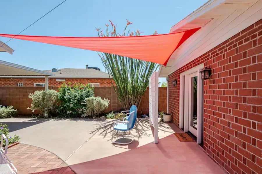 There's a small privacy fence and big shade sail / awning for extra shade in the summer.