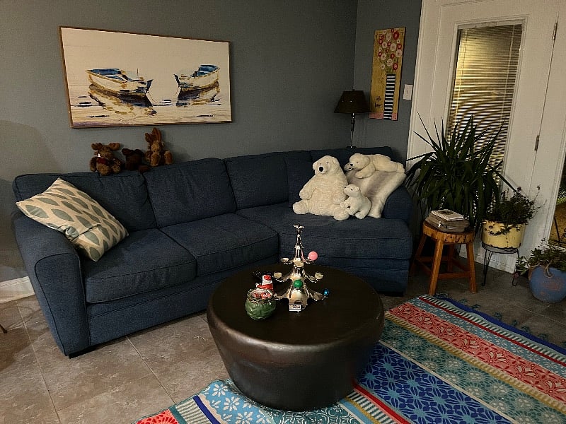 Back living room open to kitchen and overlooking pool