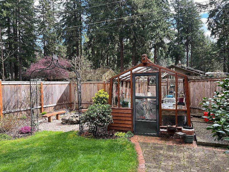Back yard fire pit and greenhouse