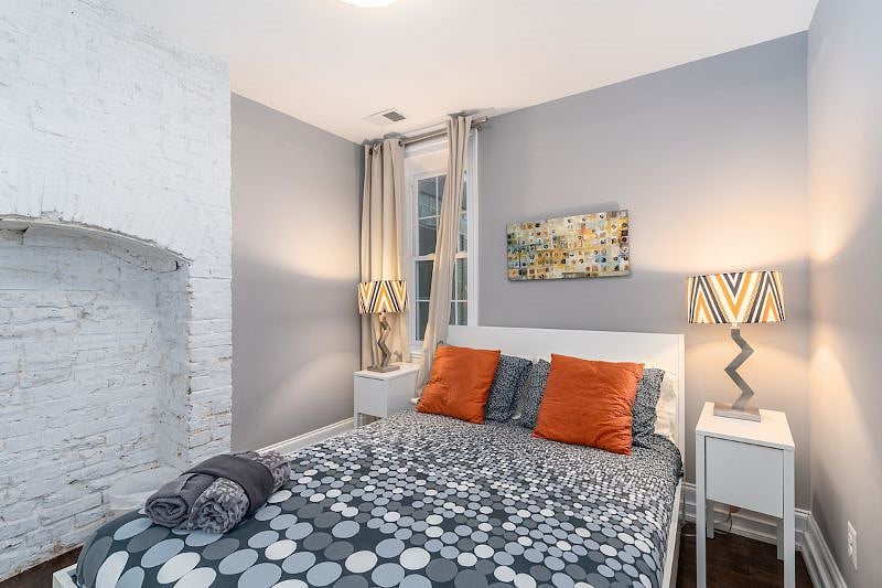 first bedroom with walk in closet and view from back yard