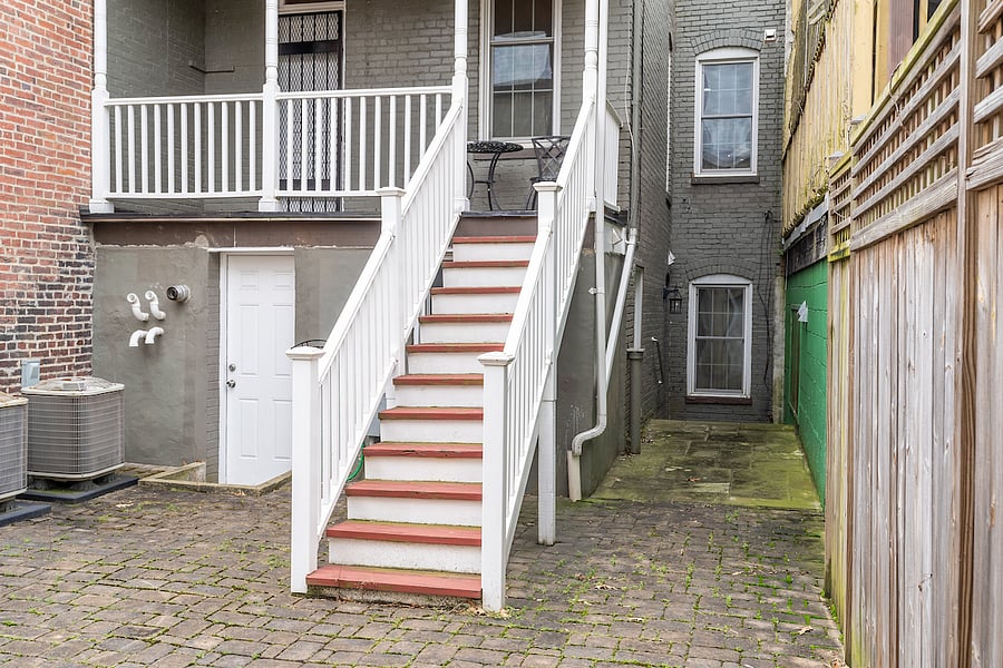 backyard area that is shared with the upstairs unit