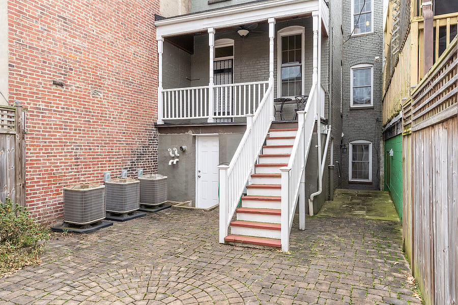 backyard area that is shared with the upstairs unit