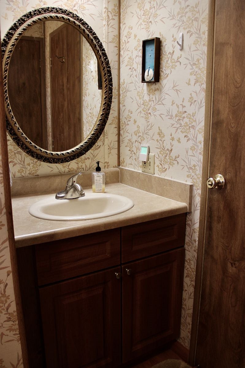 there is a large linen closet opposite the vanity