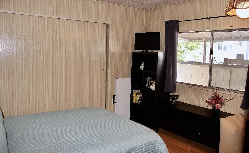 West-facing window. Dark curtains perfect for day sleepers