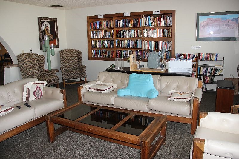 Lending library with seating - in fireplace room