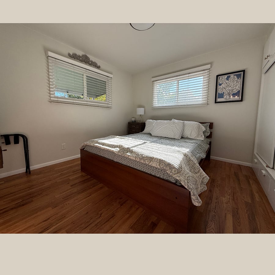 Bedroom 2 is sunny and warm.
