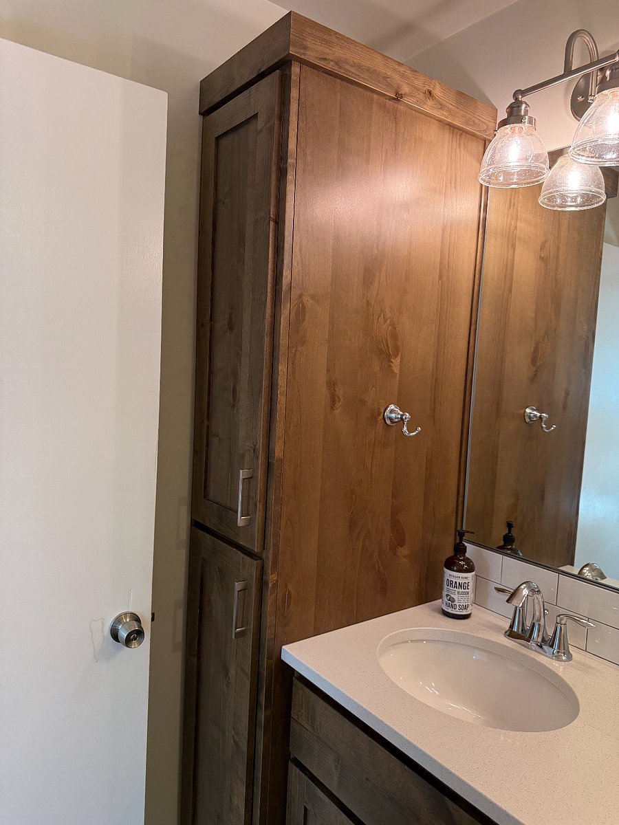Bathroom cabinets. Plenty of space to tuck away your bathroom care products. 