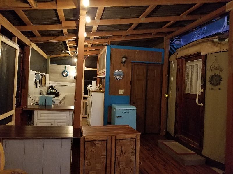 The outdoor kitchen. Doors into yurt and private bathroom.