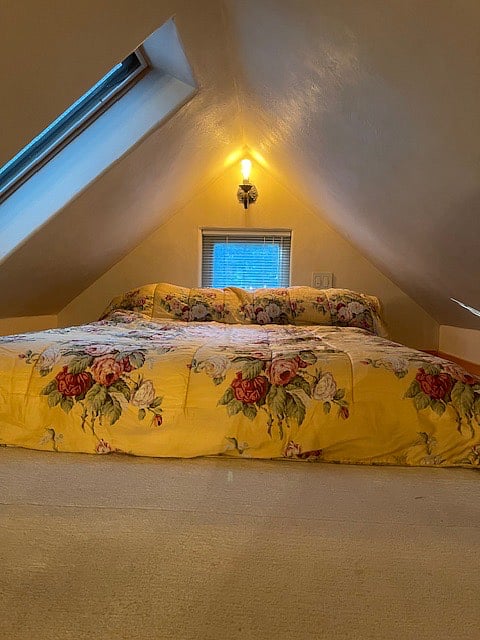 Loft Queen-sized bed on lattice frame.
