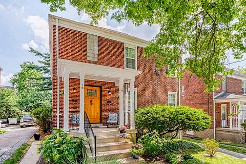 Front of house with covered porch when you have luggage, packages, or coming in out of the rain. When flowers are in bloom it's pretty green.