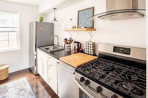 Full kitchen with stainless steel appliances plus a dishwasher.