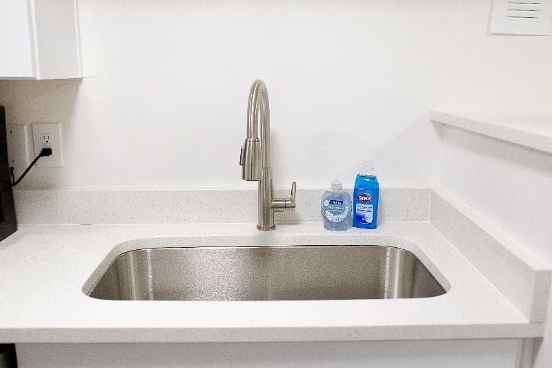 new sink. Quartz countertops through entire kitchen