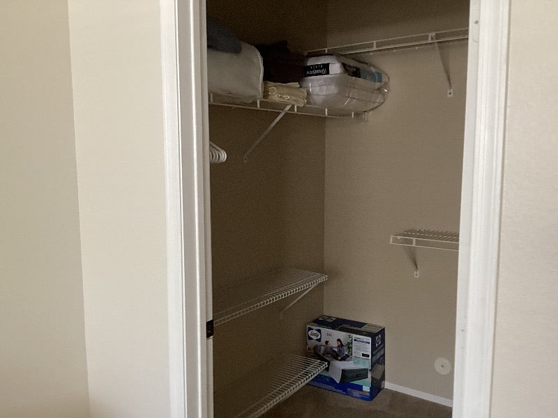 Walk in Closet with extra bedding and blow up bed