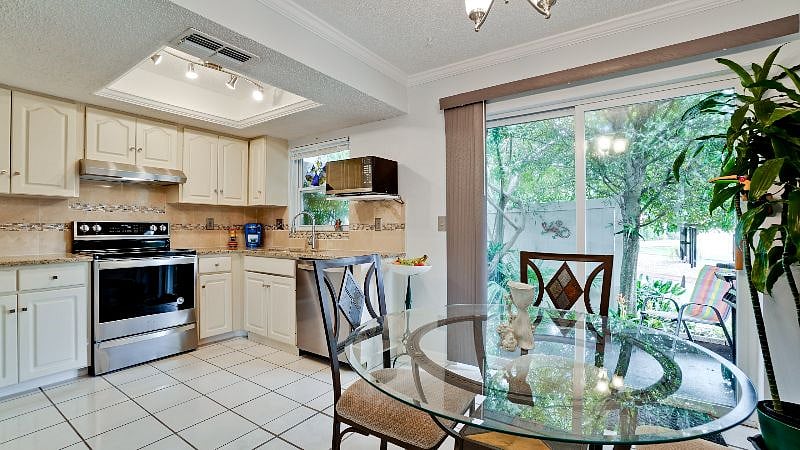 The countertops and backsplash are granite-  marble & mother-of-pearl ..Sink and faucet  And all appliances, Jan 2021..,the oven and microwave also have convection.