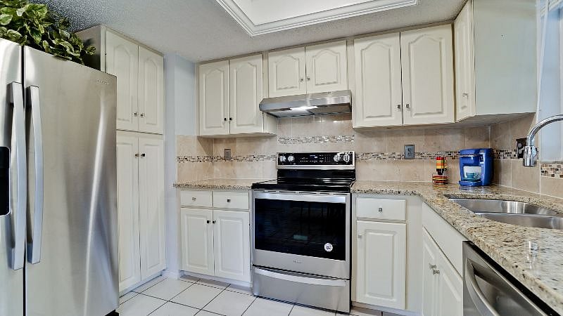 garbage disposal coffee maker toaster oven, toaster, dishes silverware cutting boards  glassware Also wine glasses ..pots/pans... You also have a water filter so no dragging home endless bottles of water