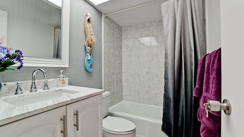Second bathroom, referred to as the guest bathroom, is in good shape, and faucet swivels! Towels are thick