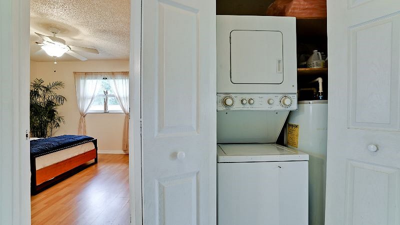 hallway between  the bedrooms Has a linen closet and a washer/ dryer and full-size hot water heater.. We will start you off with your Supplies for laundry
