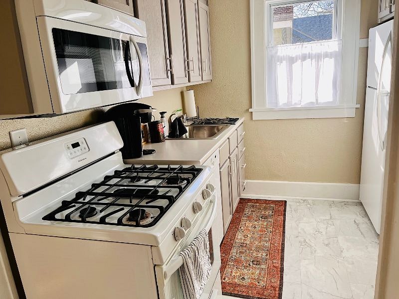 Fully equipped kitchen with Keurig coffee maker, air fryer, crockpot and more. 