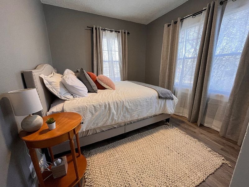 Comfortable queen beds with blackout curtains.