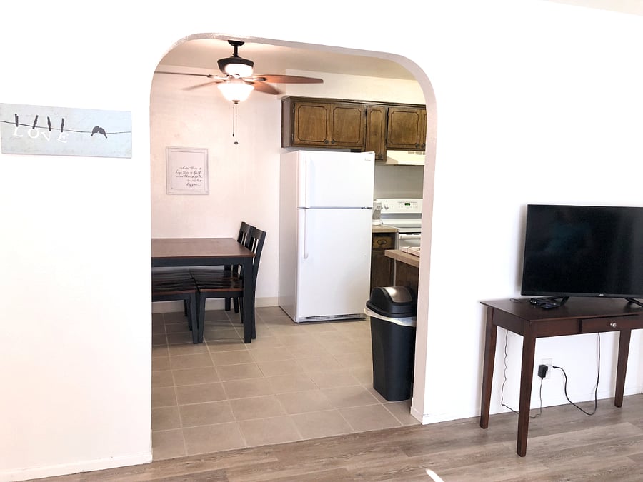 Arched entrance to dining and kitchen areaK