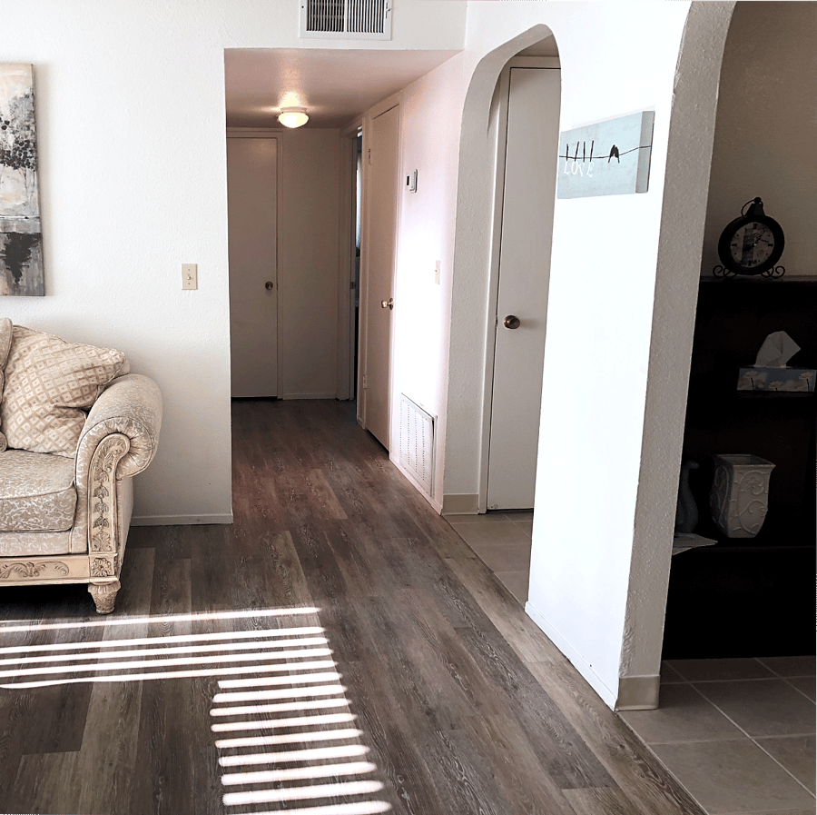 Shows hallway to bedrooms and main bathroom