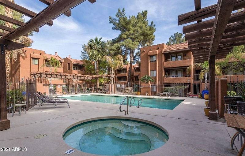 A heated Pool and a Hot Tub - gated pool area