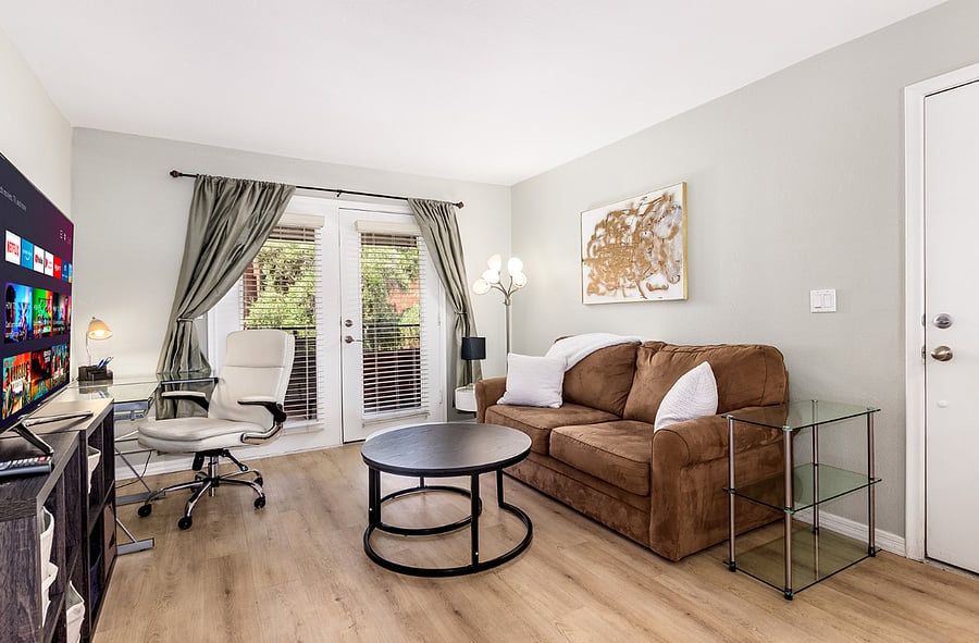 French Door to the Balcony and an expandable Sofa that can be turned into a queen size bed