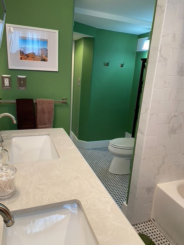 View from standing next to the shower, looking back out towards the hall