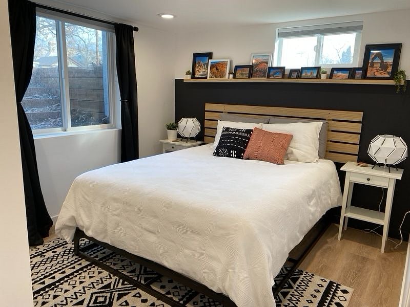 Bedroom with queen bed. Egress windows let lots of light in, and blackout shades/curtains for at night