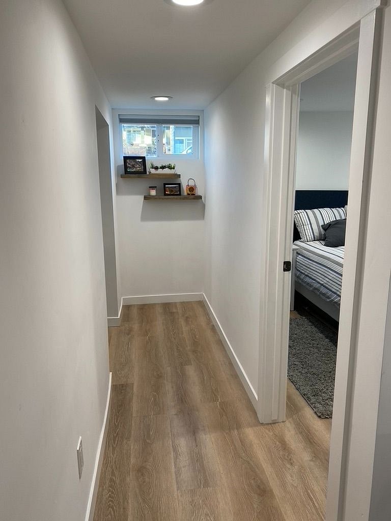 From the living room, head down the other hall (to the left) to the second bedroom and kitchen