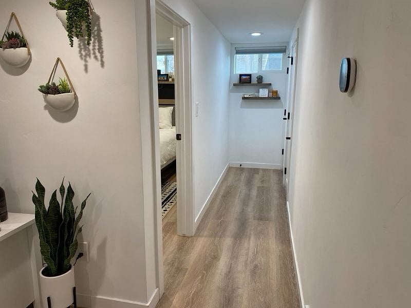 Down the hall to the right is one bedroom (on the left) and the bathroom (door at the end of the hall). There is also a storage closet at the end of the hall.