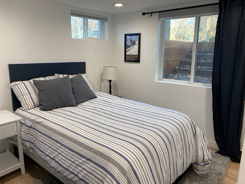 Across from the kitchen is the second bedroom. There is a full size bed and we've added two nightstands (not shown in photo)