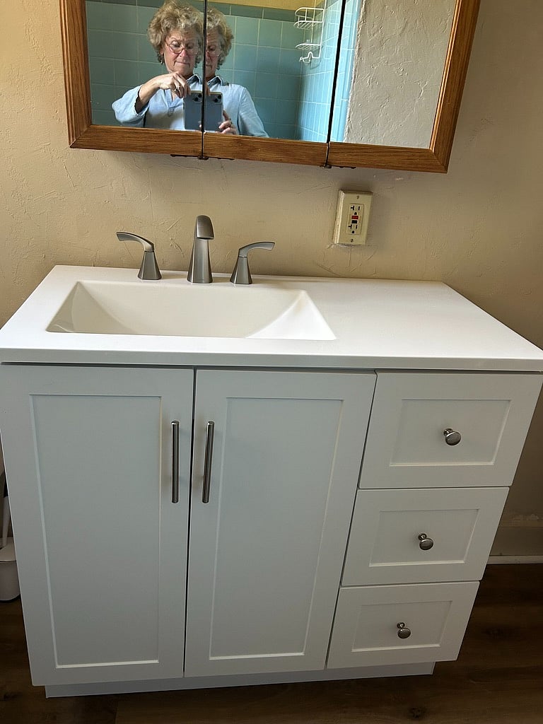 New bath vanity, floor and refinished tub in bath 1