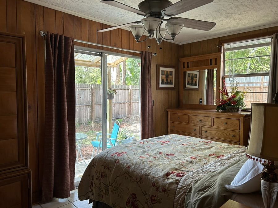 bedroom 2 with patio door to covered patio