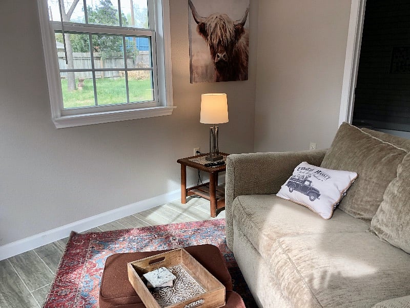 Nice windows connect you to the outdoors. There is a large backyard available to enjoy thru the gate