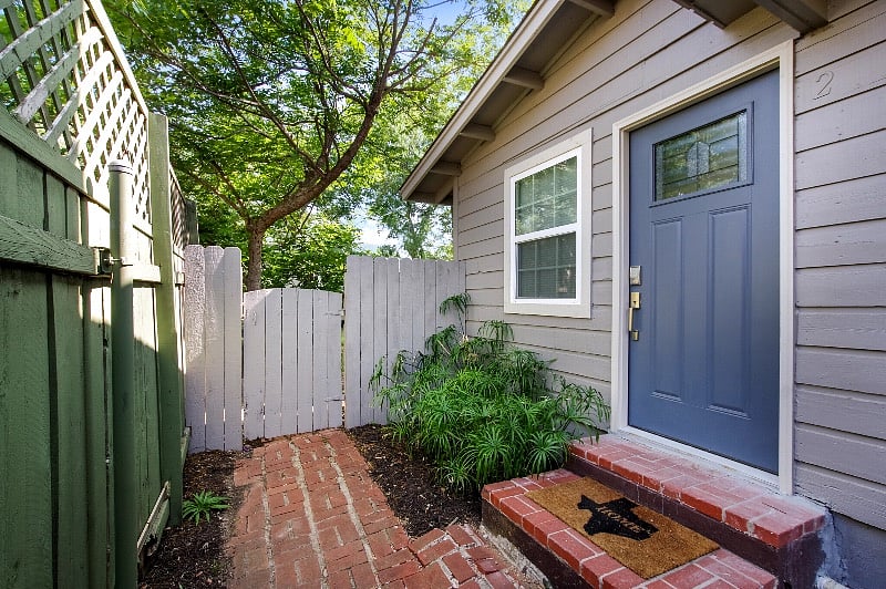 Private entrance at the side of home, down motion sensor light pathway. Coded bolt entry system
