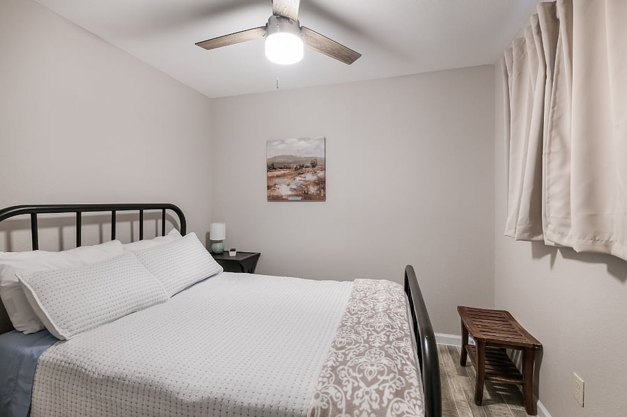 Full-size bed with knock-out curtains for great sleep
