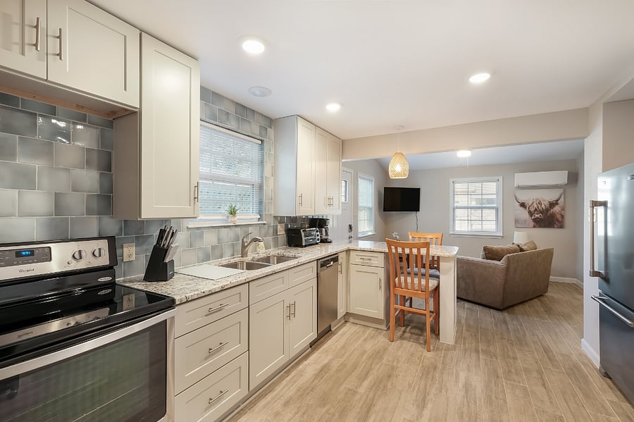 We were able to design a full-size kitchen in this sweet apartment. Full-size refrigerator, stove, microwave, even a toaster oven & small dishwasher!