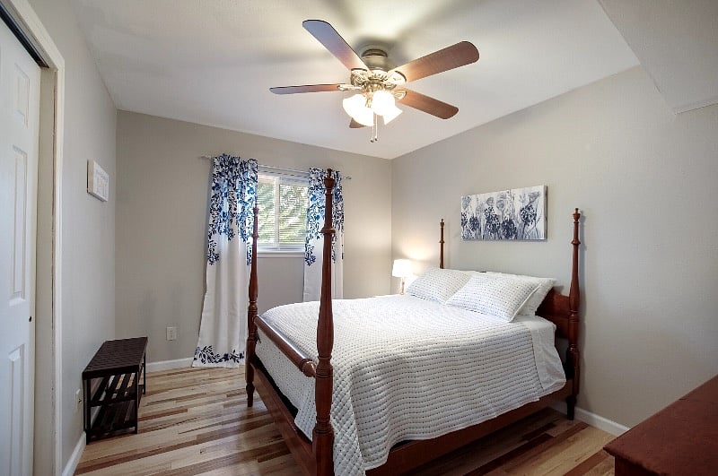 Third bedroom "Blue Room" with light filtering curtains (not block-out) on one window, a Full-size bed and a full closet