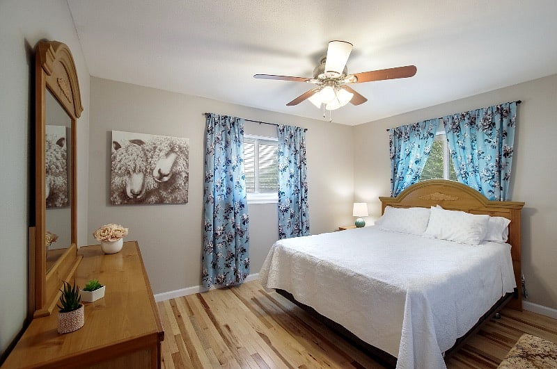 Second bedroom "Sheep Room" upstairs with light filtering curtains (not block-out) on two windows and queen bed