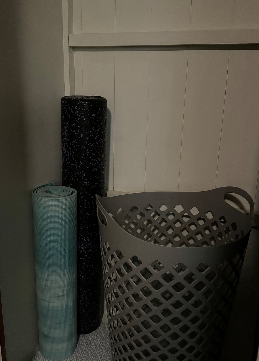 Yoga mat and roller in primary bedroom closet