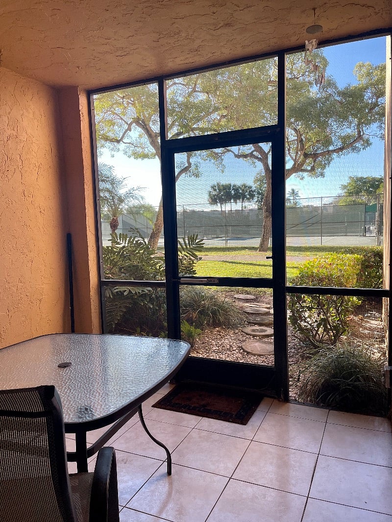 Enclosed patio, steps from pool